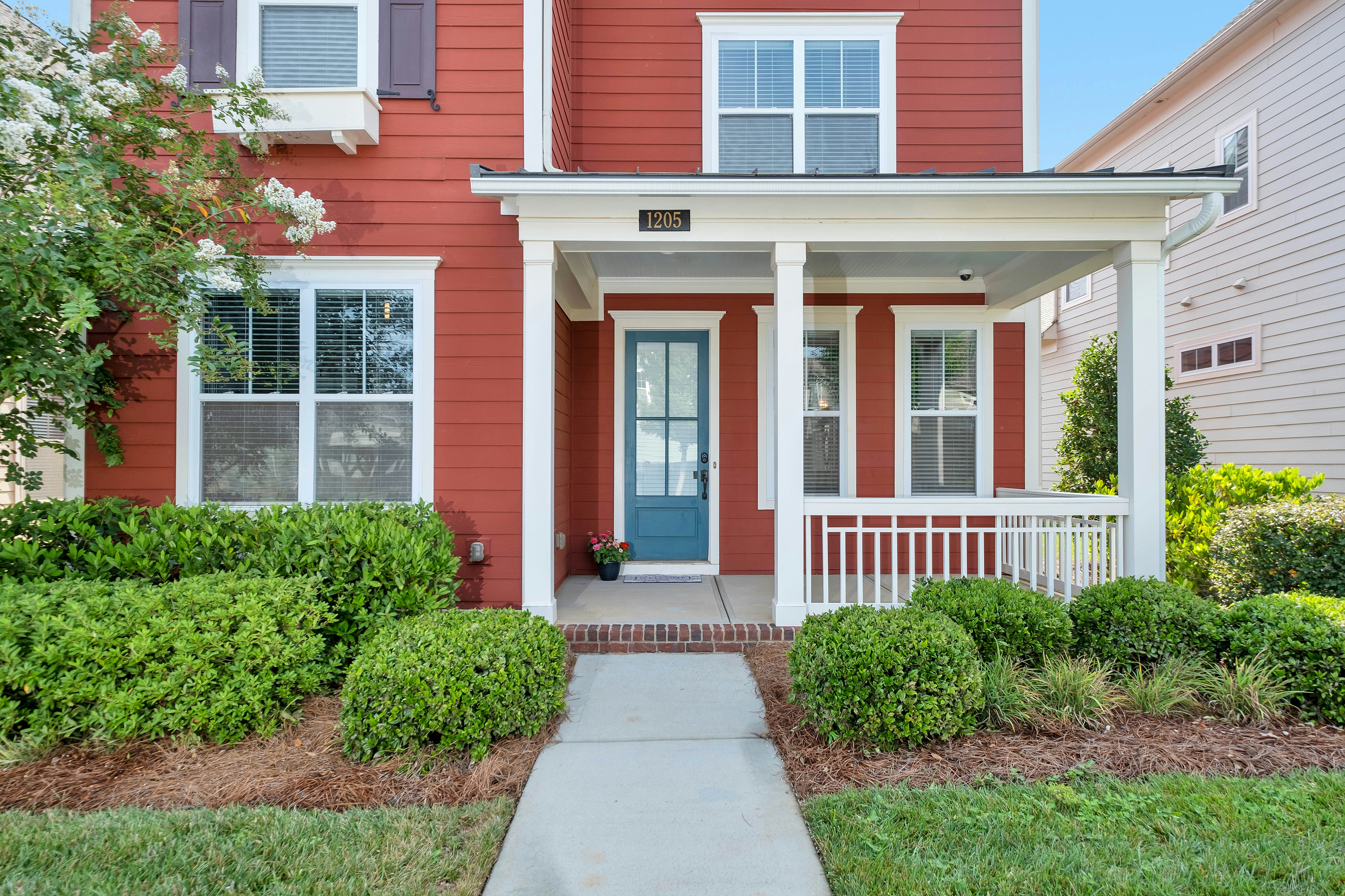 Two-story white siding home with two-car garage — cash offer received within hours in Atlanta